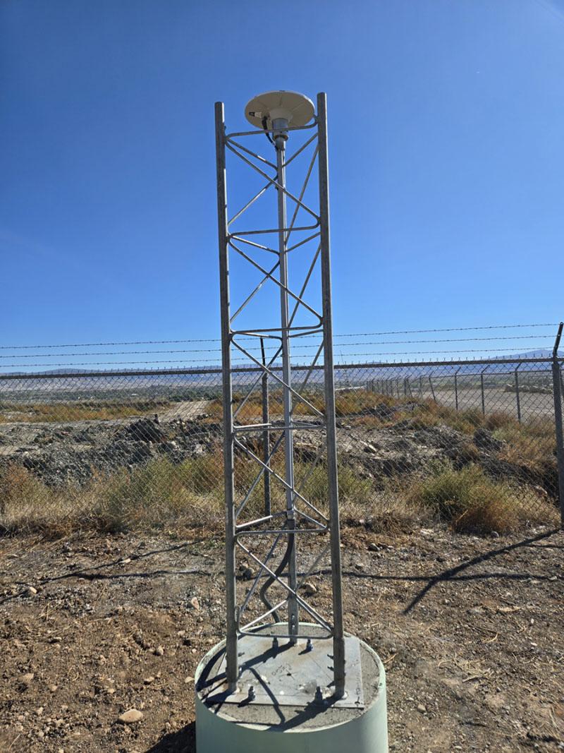 Reference station antenna set in the dessert showing a blue sky background.