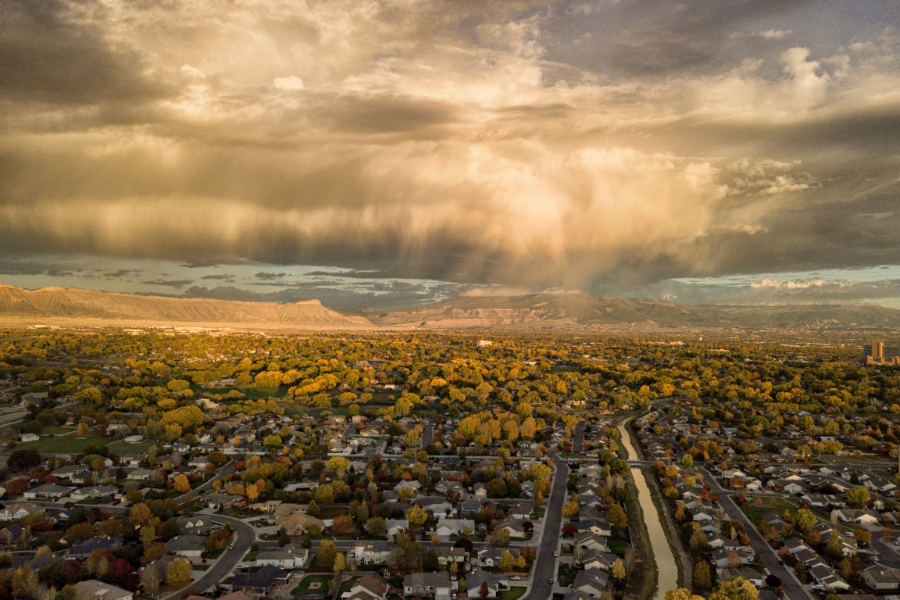 Drone image of Grand Junction, showing homes and streets below.