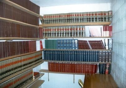 Historical photograph of Jail library with books on shelves