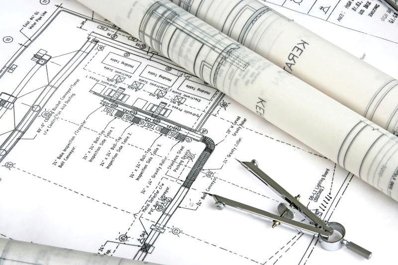 Photograph of Engineering Blue Print with Divider and two other plans rolled up on top