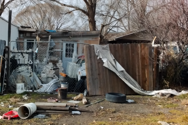 Yard with junk in it.