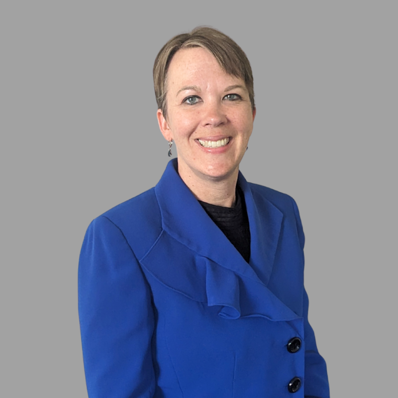 Professional photo of woman wearing a blue blazer.