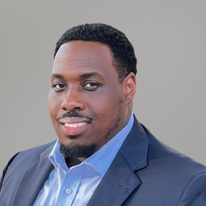 Professional photo of a man wearing a gray suit.