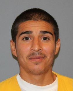 Inmate Jaime Sahagun Cardenas in a yellow jumpsuit.  