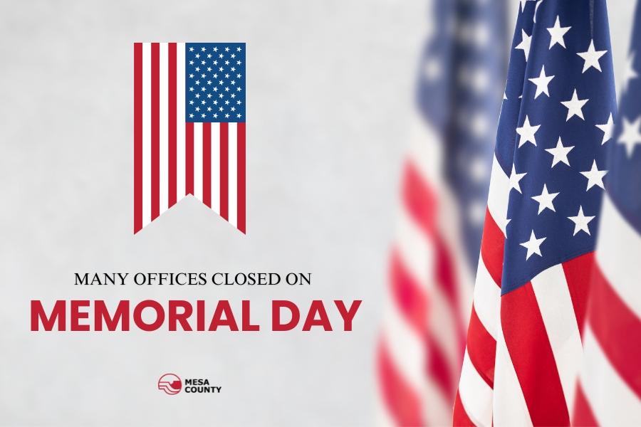 American flags on the right with black and red text on the left reading, "Many offices closed on Memorial Day," with the Mesa County logo below. 