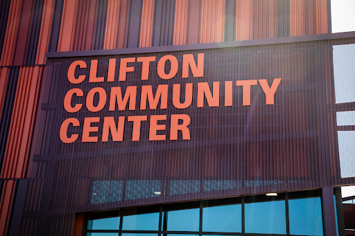 Purple and orange building with orange letters reading, "Clifton Community Campus."