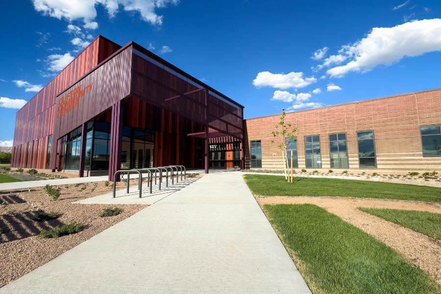 Purple, orange, and brick building with orange sign reading, "Clifton Community Campus."