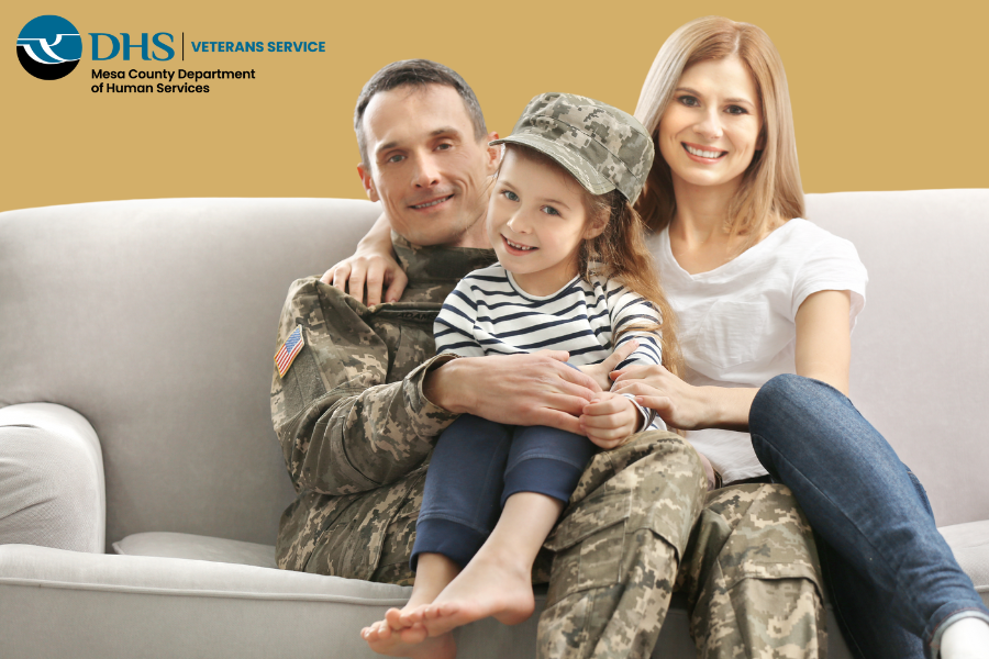 family sitting on the couch with yellow background and Veterans Service logo in the corner.