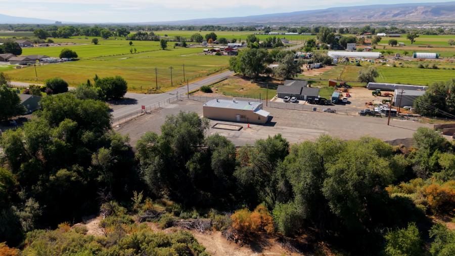 Drone photo of a large garage on a gravel lot on 23 Road in Grand Junction. 