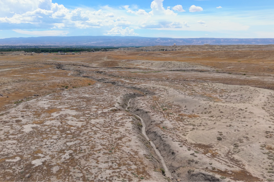 Drone photo of desert landscape between the Book Cliffs and Interstate 70 in the Clifton area of Mesa County.