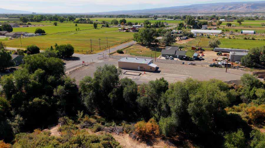 Drone photo of a large garage on a gravel lot on 23 Road in Grand Junction. 