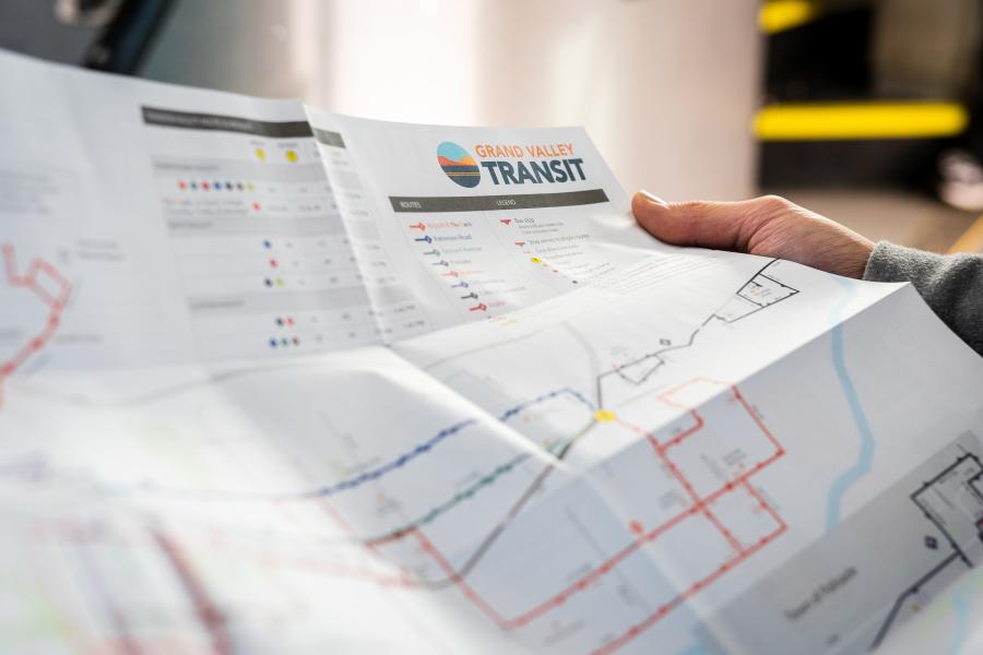 Image of someone reading the Grand Valley Transit system map